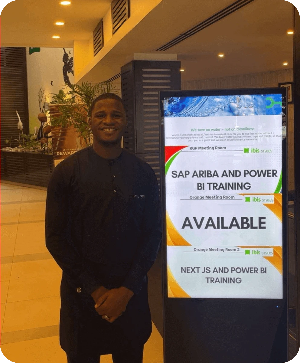 Venue signage listing SAP Ariba and Power BI training, and Next.js and Power BI training, in adjacent meeting rooms.