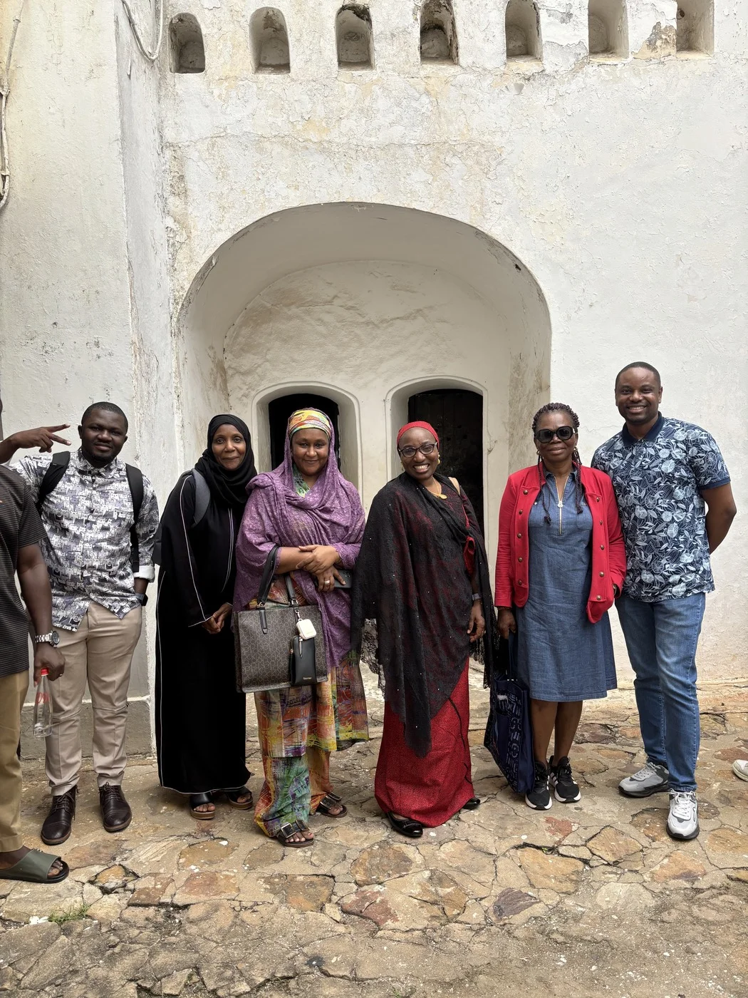 A cohort visiting a historic site on the coast during an international training trip in Ghana.