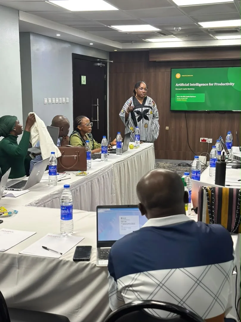 A Timalytics facilitator leading a Microsoft Copilot workshop for a seated cohort.